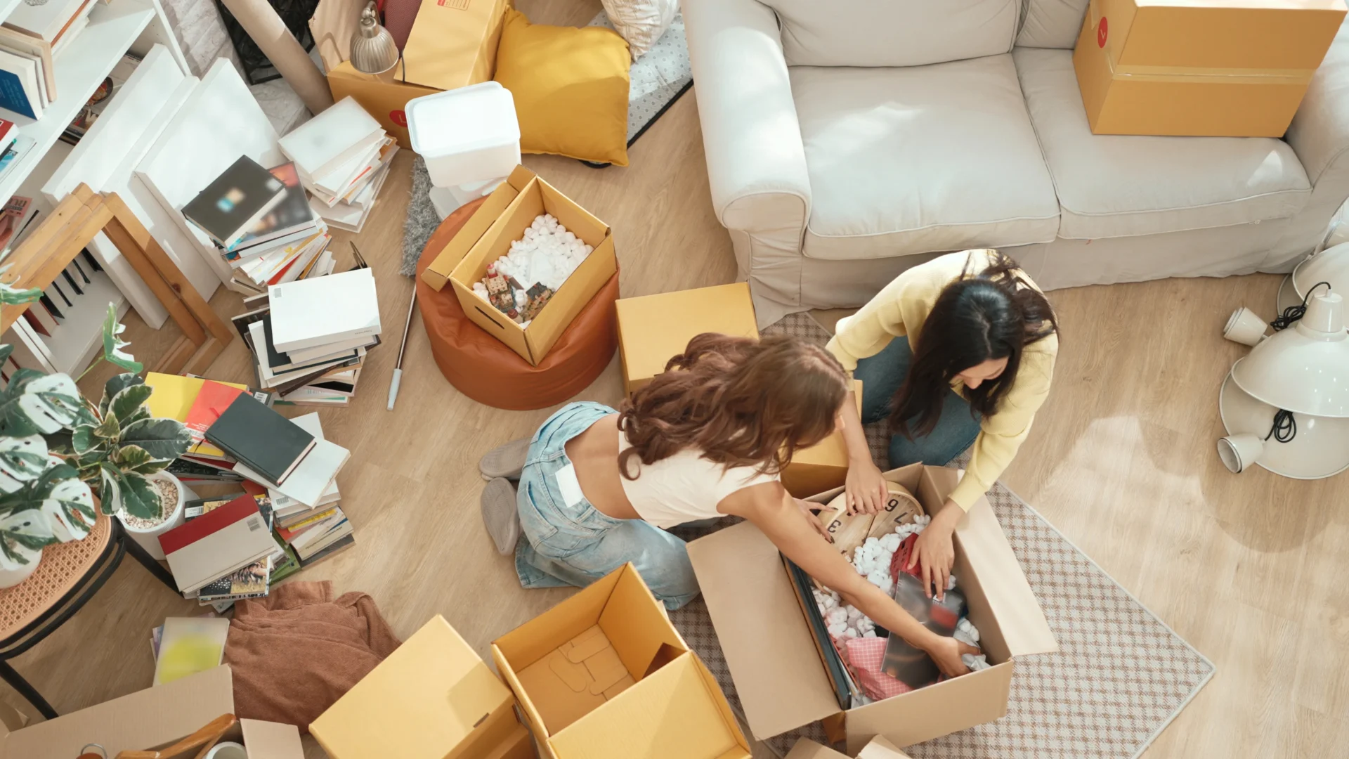 Overhead View Of Couple Packing Boxes At Home, Movers And Packers Perth
