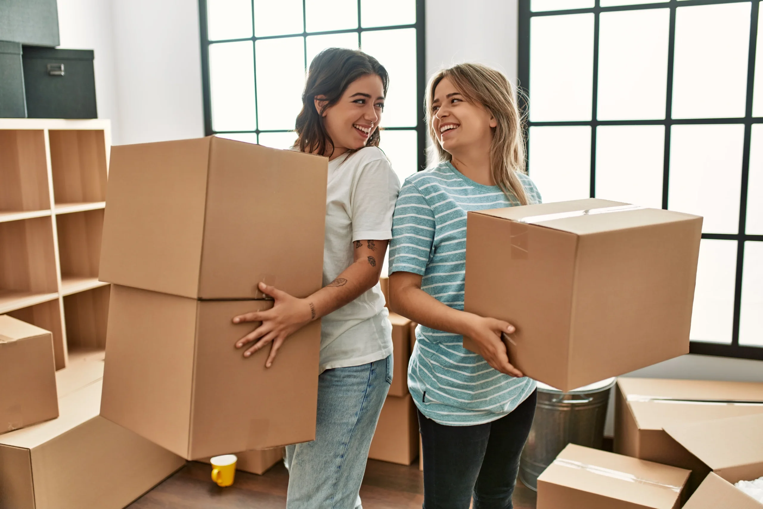 Two Women Moving With Ease Thanks To Expert Packing Services Perth Residents Rely On